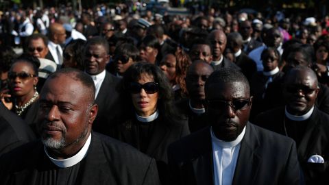 Members of the church wait to be let inside for the funeral of the Rev. Clementa Pinckney on June 26. His eulogy was given by former president Barack Obama. 