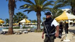 A Tunisian security member stands next to a swimming pool at the resort town of Sousse, a popular tourist destination 140 kilometres (90 miles) south of the Tunisian capital, on June 26, 2015, following a shooting attack. At least 27 people, including foreigners, were killed in a mass shooting at a Tunisian beach resort packed with holidaymakers, in the North African country's worst attack in recent history. AFP PHOTO / FETHI BELAID        (Photo credit should read FETHI BELAID/AFP/Getty Images)