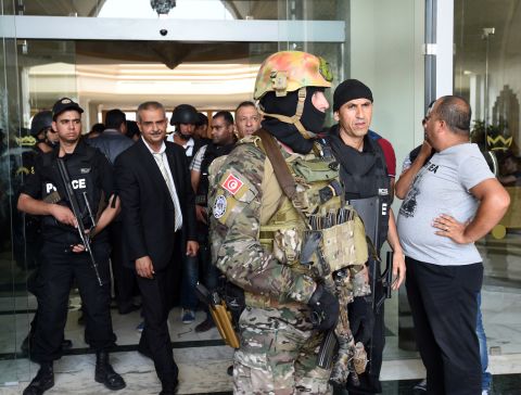 Tunisian security forces stand in front of Hotel Riu Imperial Marhaba on Friday, June 26.
