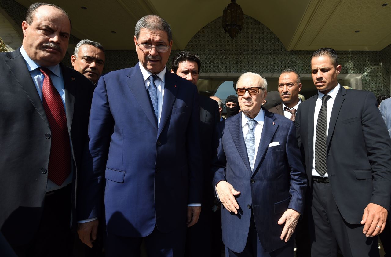 Tunisian President Beji Caid Essebsi, third from right, arrives at the resort with Prime Minister Habib Essid, third from left, and Interior Minister Mohamed Najem Gharsalli, far left.