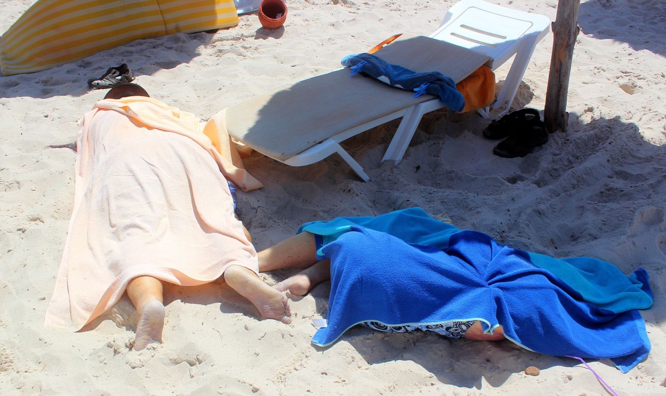 Dead bodies are seen on the beach.