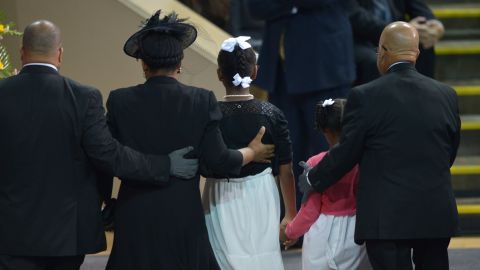 The Pinckney family walks together before Obama's eulogy.