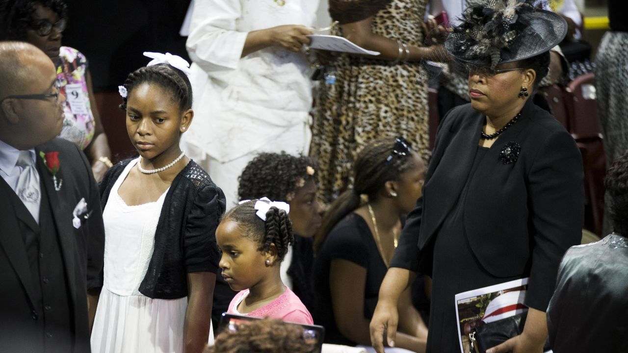 Pinckney's wife, Jennifer, attends the service with her daughters Eliana, left, and Malana.