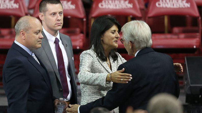 South Carolina Gov. Nikki Haley hugs Charleston Mayor Joseph Riley as they arrive for the funeral.