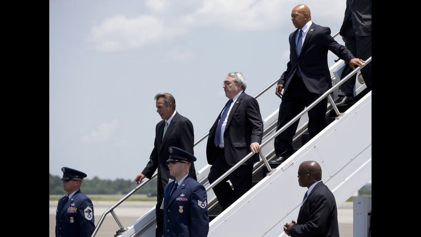 Members of Congress get off Air Force One in Charleston as they accompanied Obama to the service.