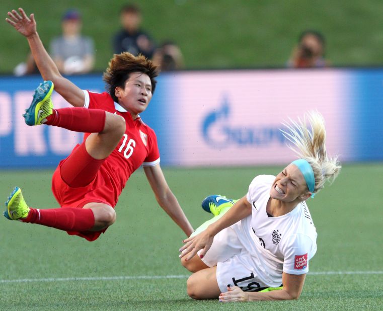 China's Lou Jiahui collides with U.S. defender Julie Johnston.