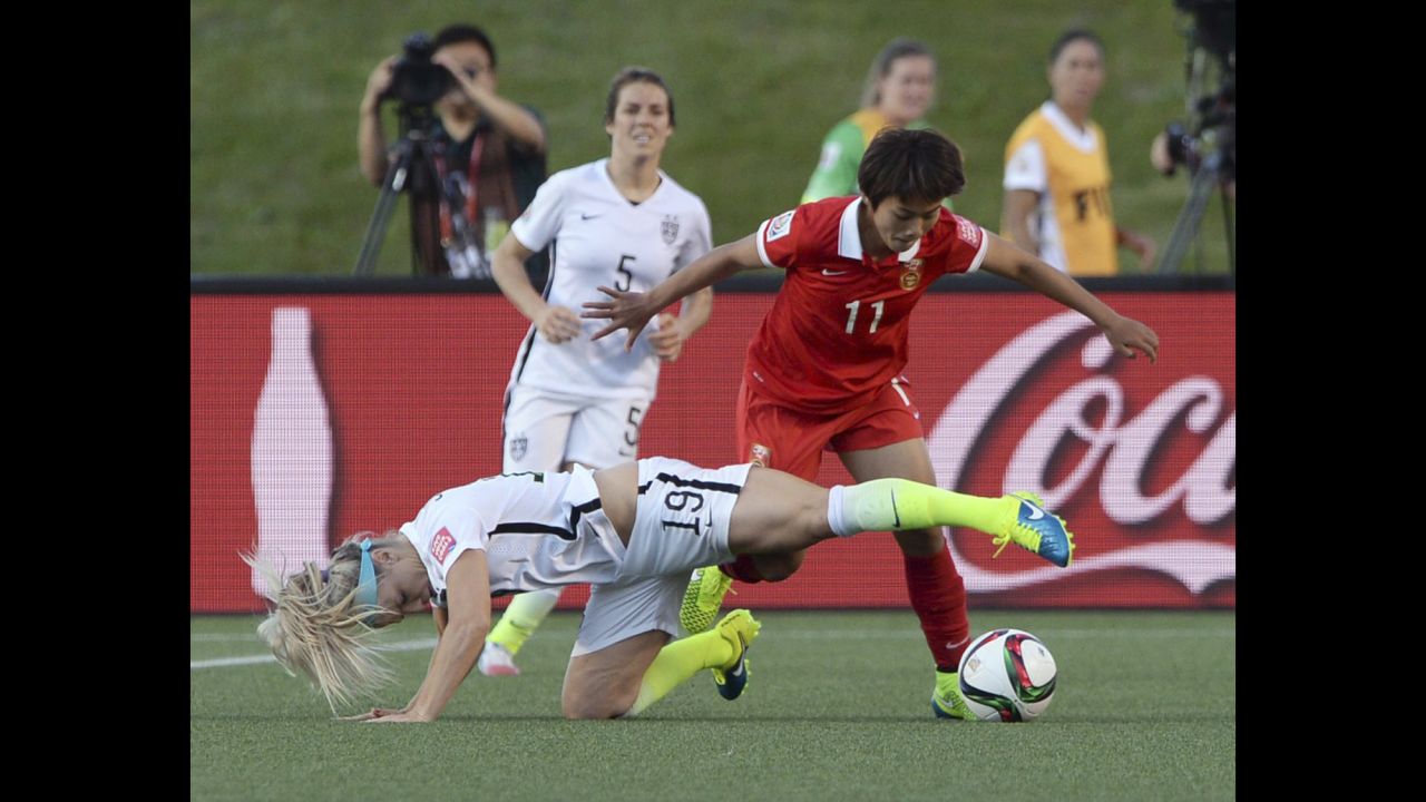 Johnston and China's Wang Shuang vie for the ball during the second half.