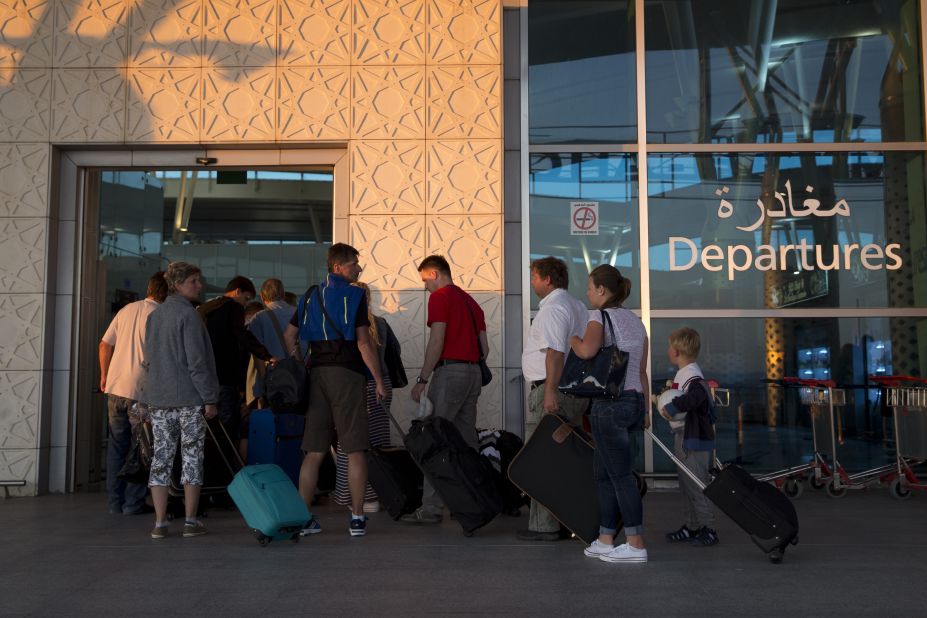 Tourists leave Tunisia at the Enfidha International airport a day after the attack.