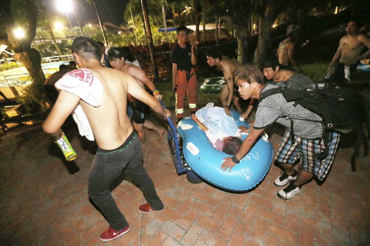 Concert spectators tend to injured victims after an accidental explosion during a music concert at the Formosa Water Park in New Taipei City, Taiwan, on June 27.