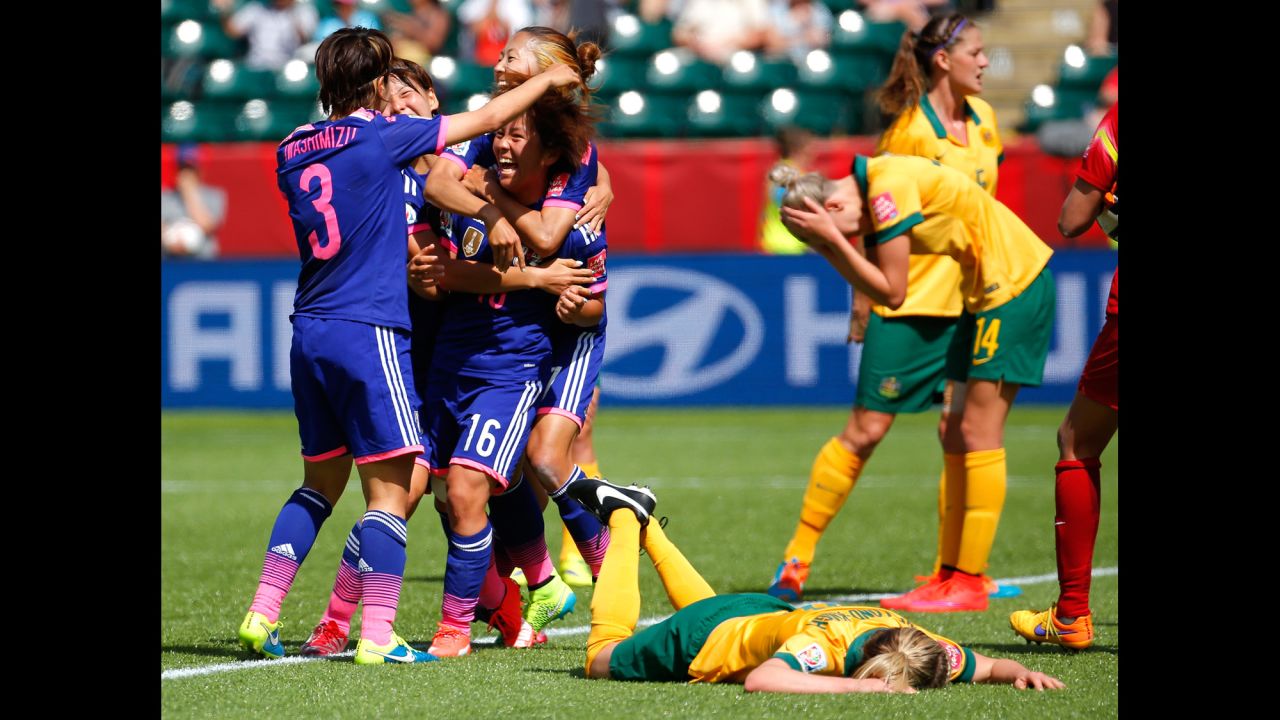 Japanese players celebrate a goal scored by Mana Iwabuchi (No. 16) during a match against Australia on June 27. It was the only goal scored in the quarterfinal match, which was played in Edmonton, Alberta.