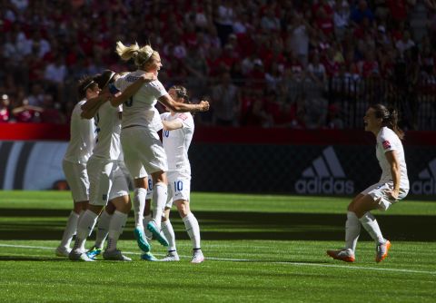 England players celebrate a goal during their 2-1 victory over Canada in the Women's World Cup on Saturday, June 27. The victory in Vancouver, British Columbia, gave England its first-ever trip to the semifinals.