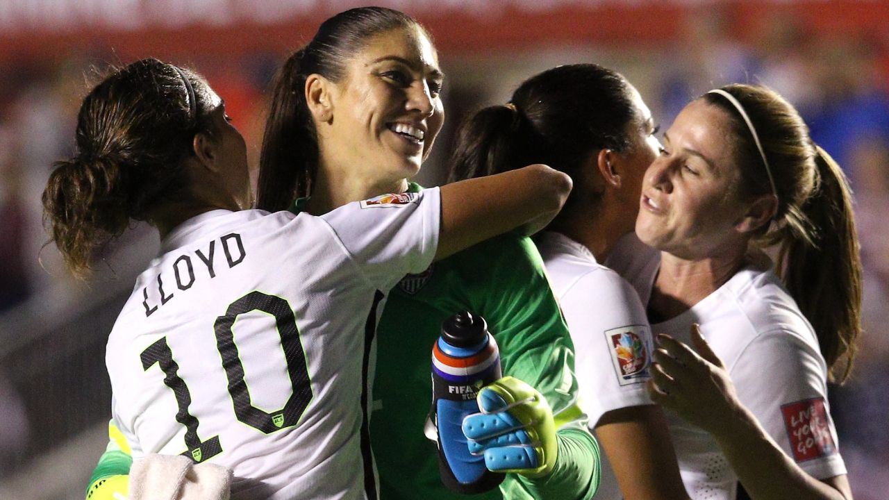 Hope Solo celebrates with Carli Lloyd after defeating China 1-0 in the FIFA Women's World Cup 2015 Quarter Final match in June 2015.