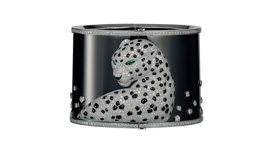A watch-cuff bracelet made from white gold and set with 937 brilliant-cut diamonds, two emeralds, and onyx in 2013. 