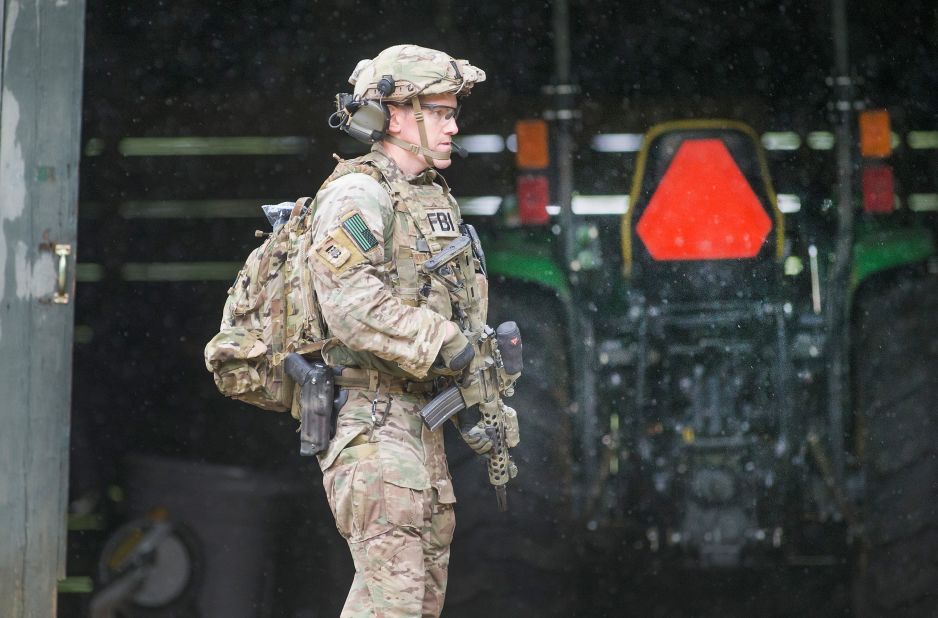 FBI agents conduct a search for Sweat near Duane on June 28.