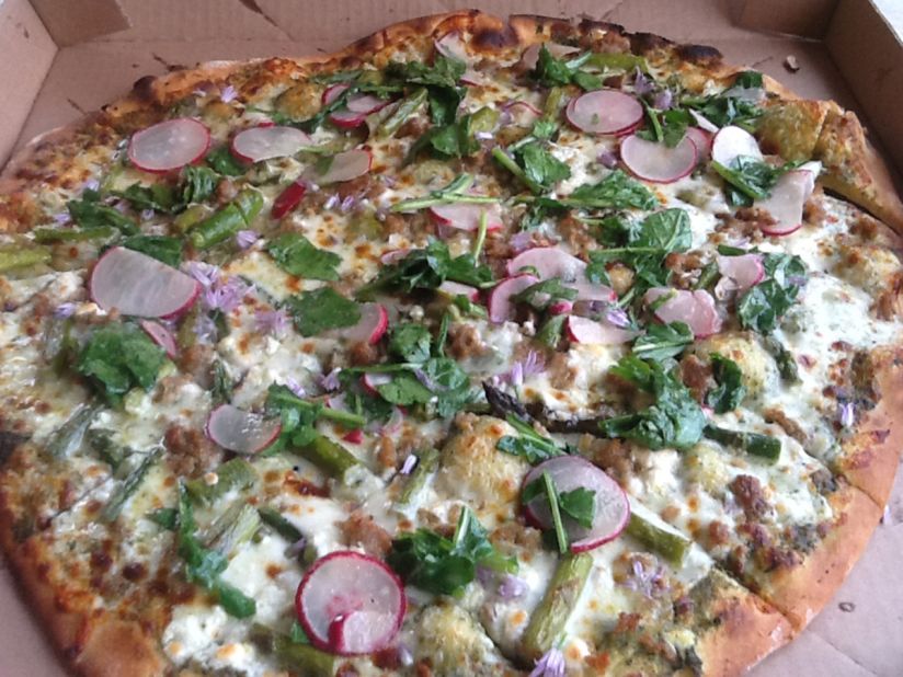 The Spring Fling pizza at Suncrest Gardens is a combination of arugula, asparagus, sliced radishes and pesto.