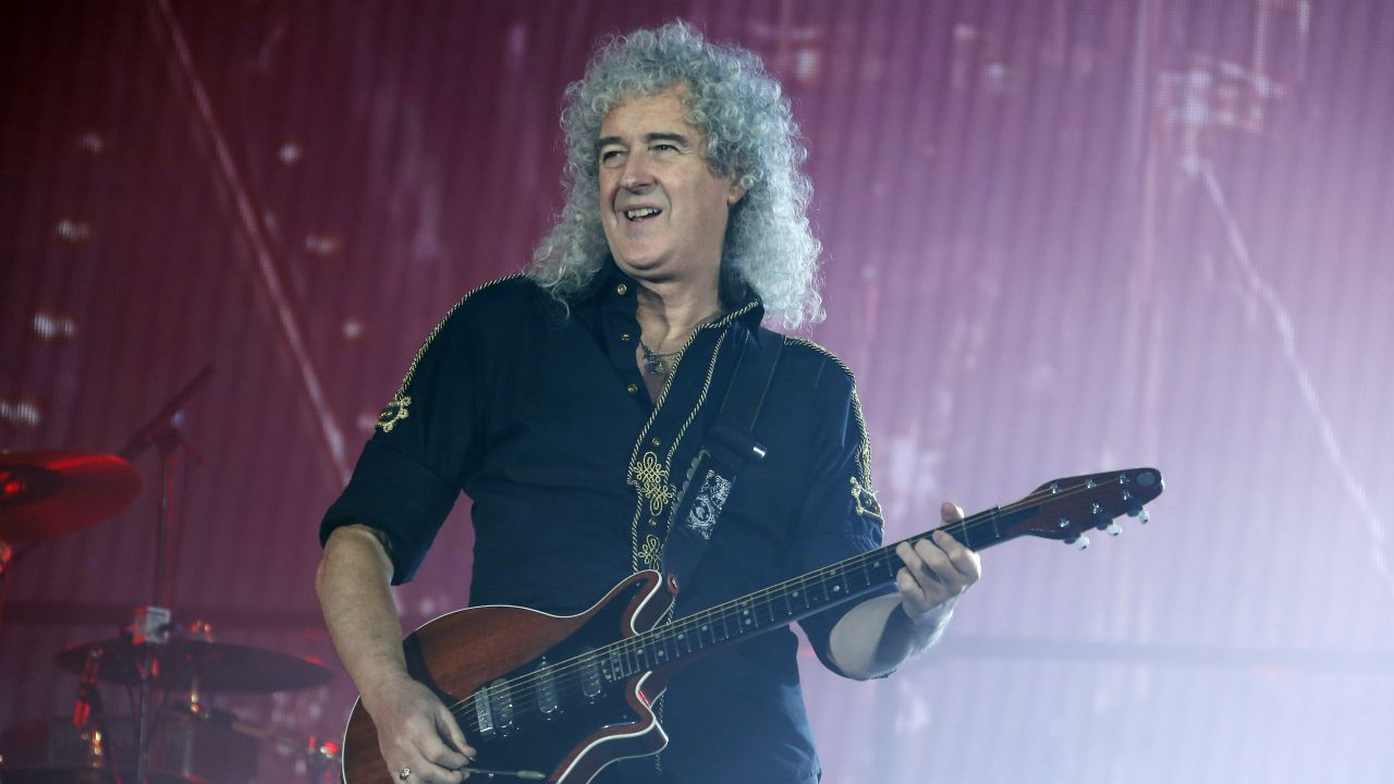Queen's performance was hailed as a highlight of Live Aid. Lead guitarist Brian May -- who now holds a doctorate in astrophysics -- is shown here in 2015. The band's current lead singer, Adam Lambert, stands in for the late Freddie Mercury who died in 1991. 