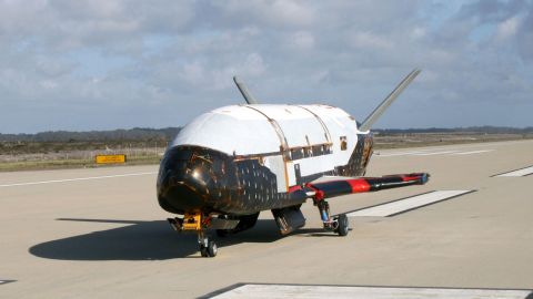 In a testing procedure, the X-37B Orbital Test Vehicle taxis at Vandenberg AFB, California, in June 2009. The X-37 is an unmanned military space plane that is powered into space on a rocket and lands like a conventional aircraft on a runway, like the now-defunct space shuttle. Systems such as the X-37 could provide crucial surveillance over areas that spy satellites are not yet covering, or offer quick replacement if the satellites are shot down. 