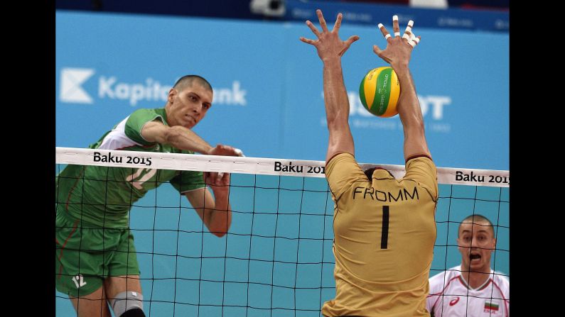 Bulgaria's Jani Jelaskov spikes the ball against Germany's Christian Fromm during the European Games' gold-medal volleyball match Sunday, June 28, in Baku, Azerbaijan. Germany won the match 3-1.
