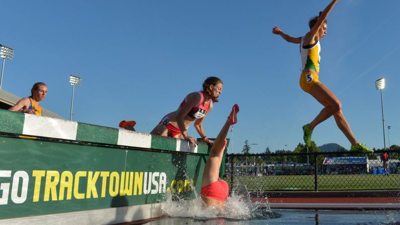 Nicole Bush falls into the water Thursday, June 25, while running the 3,000-meter steeplechase at the U.S. Track and Field Championships. She finished the race.