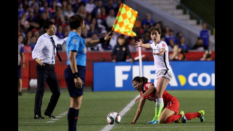 U.S. defender Meghan Klingenberg stands over China's Wang Lisi during a Women's World Cup quarterfinal match on Friday, June 26. The <a href="index.php?page=&url=http%3A%2F%2Fwww.cnn.com%2F2015%2F06%2F12%2Ffootball%2Fgallery%2Fusa-highlights-womens-world-cup%2Findex.html" target="_blank">United States</a> won the match 1-0 in Ottawa.