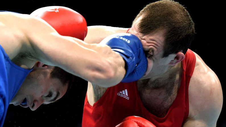 Azerbaijan's Xaybula Musalov, left, punches Belarus' Vitali Bandarenka during a middleweight bout at the European Games on Wednesday, June 24. Musalov won on points but eventually lost in the final to Ireland's Michael O'Reilly.