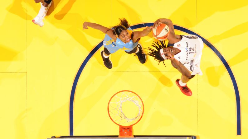 Indiana's Lynetta Kizer, right, grabs a rebound during a WNBA game against Chicago on Friday, June 26.