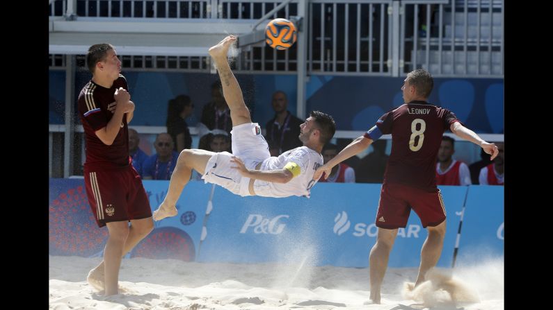 Italy's Francesco Corosiniti performs an overhead kick against Russia during the European Games' beach soccer final on Sunday, June 28. Russia won the match 3-2.