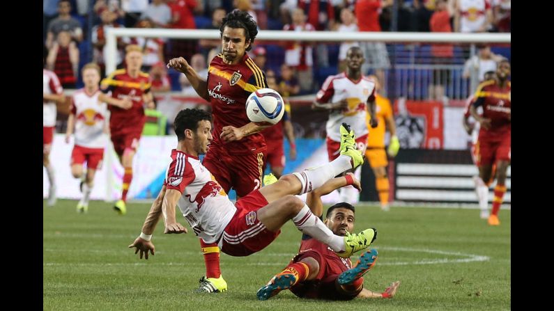 New York Red Bulls forward Felipe is tackled by Real Salt Lake's Javier Morales during a Major League Soccer game Wednesday, June 24, in Harrison, New Jersey. Morales received a red card on the play.