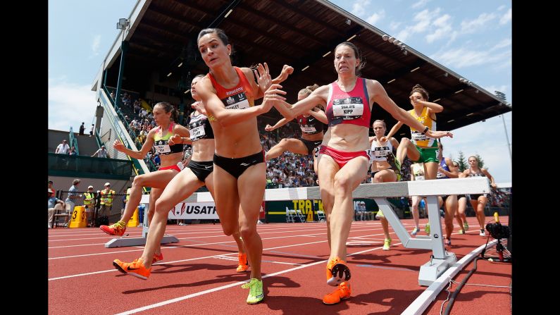 Ashley Higginson and Shalaya Kipp nearly fall Saturday, June 27, as they compete in the 3,000-meter steeplechase at the U.S. Track and Field Championships. 