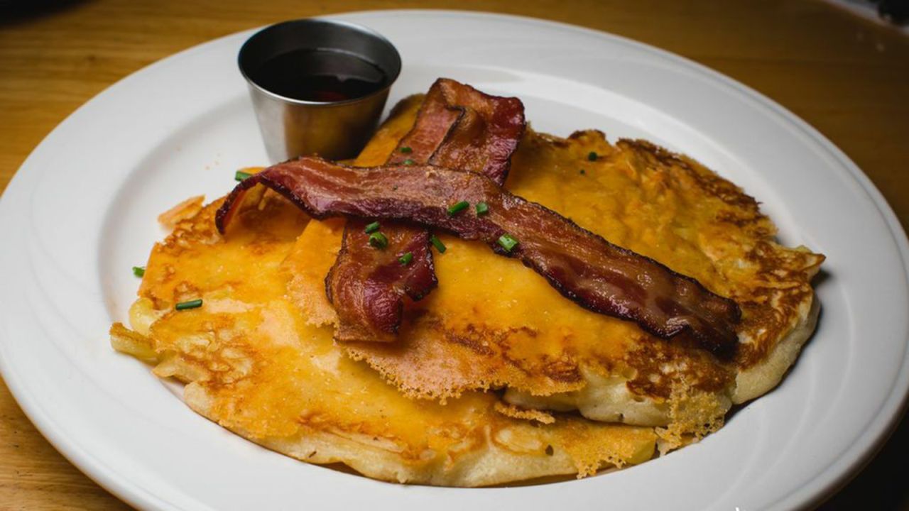 Macaroni and cheese pancakes, served at Morning Glass Coffee in Honolulu, Hawaii, are perfect for those indecisive diners who can't decide whether they want breakfast or lunch.  