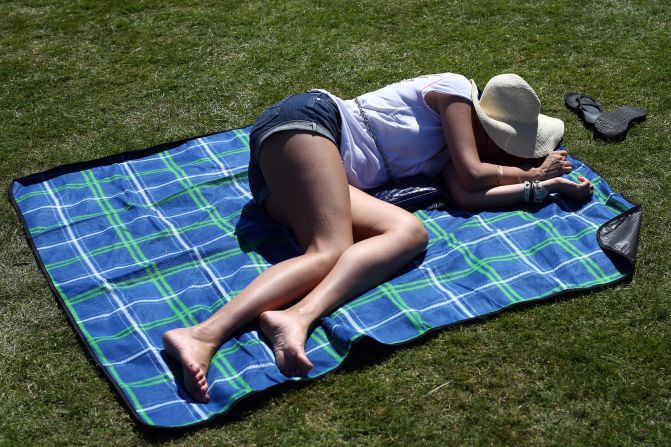 It was that kind of a day at Wimbledon -- taking a nap in the sun. Temperatures are expected to soar to 33 degrees Celsius (91 Fahrenheit) on Wednesday. 