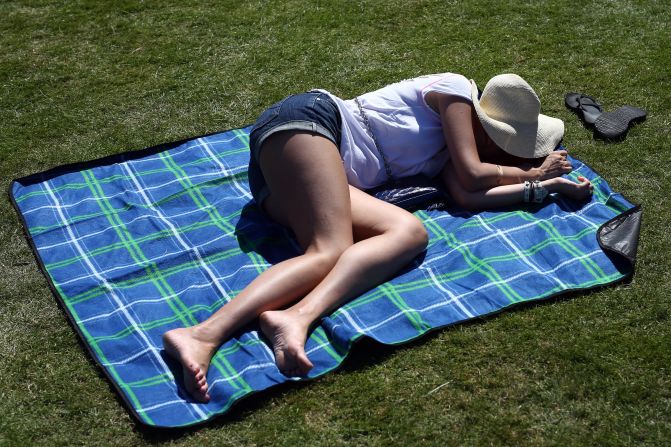 It was that kind of a day at Wimbledon -- taking a nap in the sun. Temperatures are expected to soar to 33 degrees Celsius (91 Fahrenheit) on Wednesday.