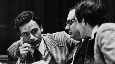 Theodore "Ted" Bundy, left, makes a point to members of his defense team at his trial in Miami in June 1979.  Bundy raped and killed at least 16 young women in the early to mid-1970s, and was convicted of three Florida slayings, including that of a 12-year-old girl. He later confessed to killing more than 30 women and girls. "He was handsome, he was very involved with politics, he was educated, he was in law school. It didn't seem like the glassy-eye lunatic that many Americans believed serial killers would be," according to author James Alan Fox.