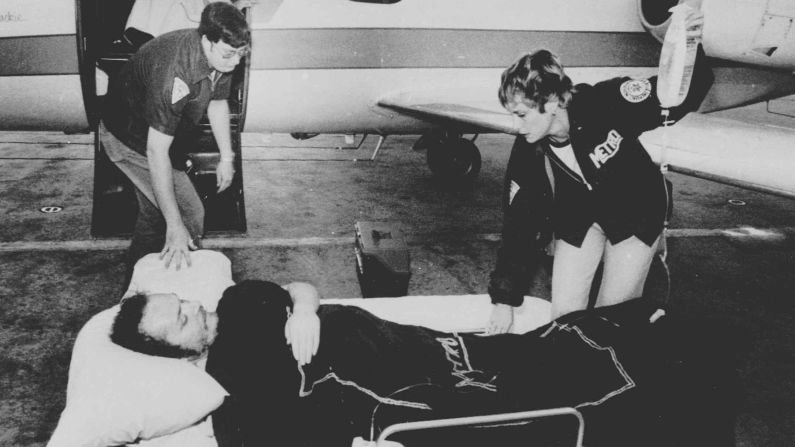 Larry Flynt, owner of Hustler magazine, lies on a stretcher in Atlanta, April 14, 1978, as attendants prepare to load him on board a hospital plane. Flynt was shot by serial killer and white supremacist <a href="index.php?page=&url=http%3A%2F%2Fwww.cnn.com%2F2013%2F11%2F18%2Fjustice%2Fdeath-row-interview-joseph-paul-franklin%2F">Joseph Paul Franklin</a> for publishing pornographic photos of a black man with a white woman. The injury left Flynt permanently paralyzed from the waist down. Franklin was convicted of six murders and claimed responsibility for as many as 22. He was executed in November 2013.