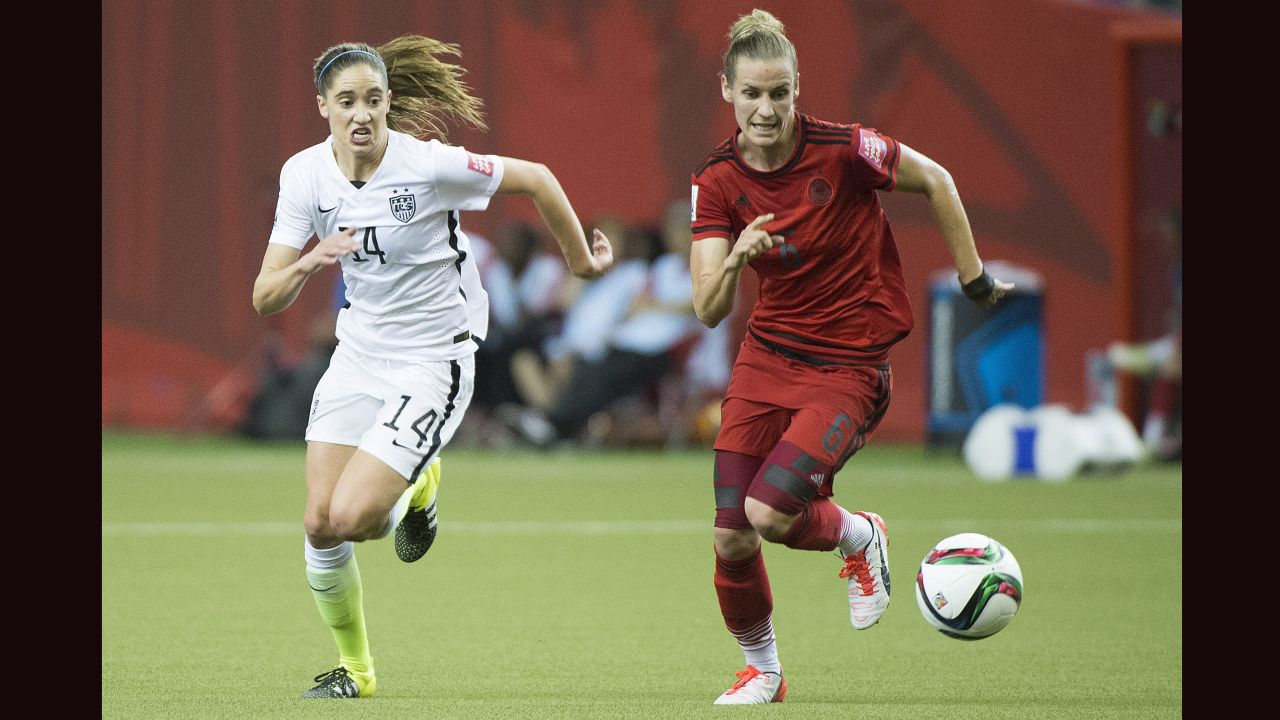 American Morgan Brian, left, and German Simone Laudehr chase down the ball.