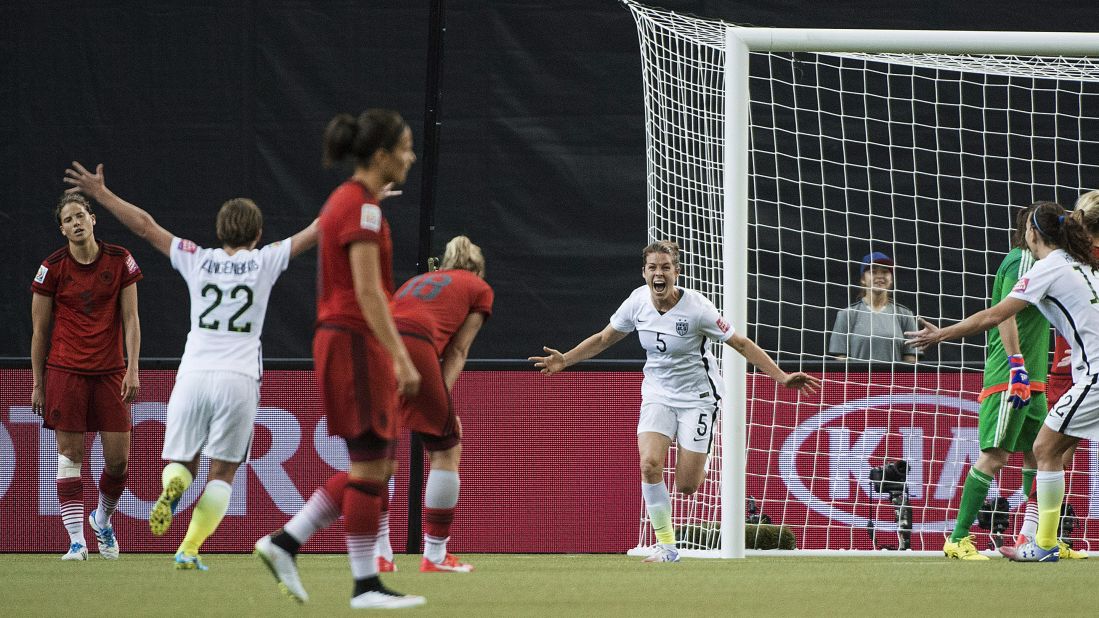American Kelley O'Hara, center in white, celebrates after scoring a goal against Germany on Tuesday, June 30. The goal, late in the second half, clinched a 2-0 semifinal victory for the Americans. They will now get a rematch against Japan, the team that defeated them in the 2011 World Cup final.