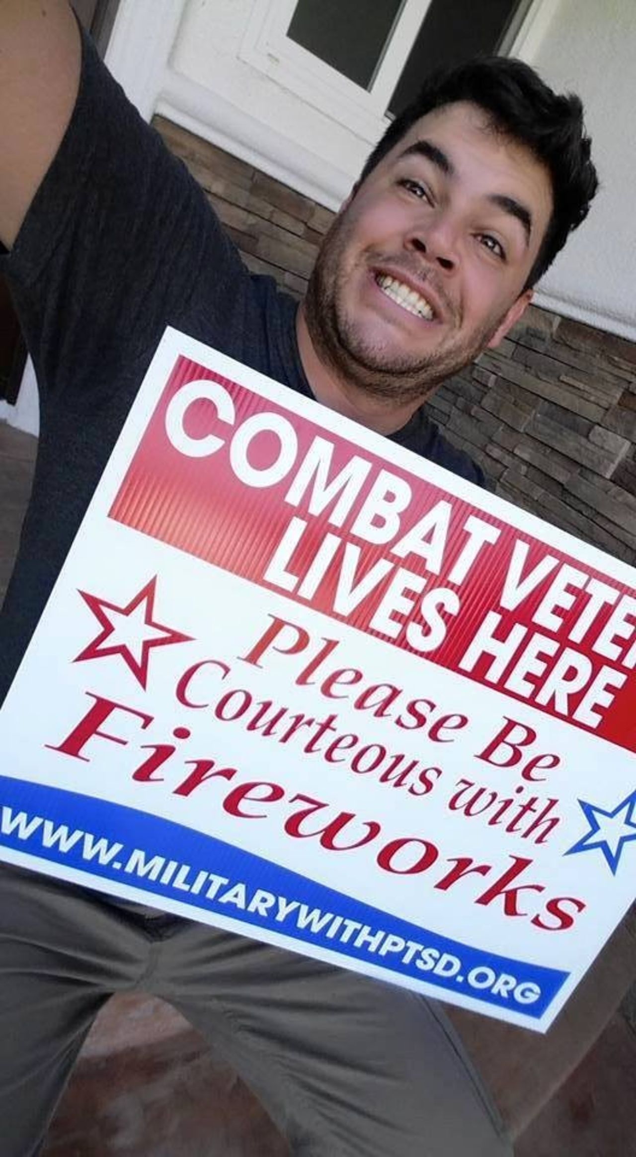 The signs ask that neighbors be courteous with fireworks near the Fourth of July by warning combat veterans. Vets like Chris Dumont, pictured above, may experience symptoms of PTSD due to the loud, explosive noises. 