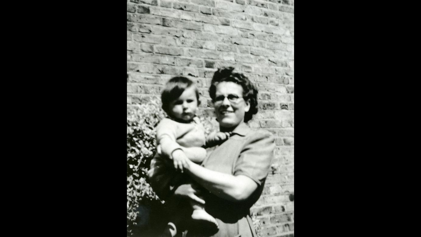 Ronnie Wood, 9 months old, is held by his mother, Elizabeth, in 1947. Wood joined the Stones in 1975, and he is known for playing the slide guitar and the lap-steel guitar.
