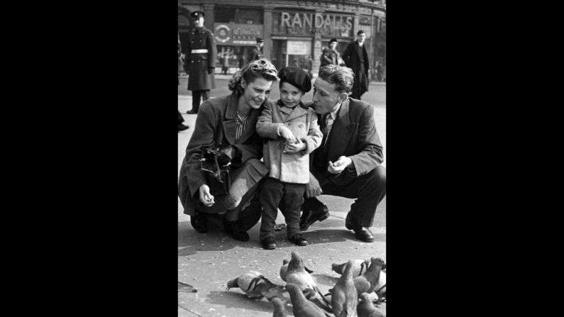 Charles Robert Watts, 2, feeds birds with his mother, Lillian, and his father, Charles, in London's Piccadilly Circus in 1943. Charlie was known as Charlie Boy because his father was called Charlie. Watts was asked to play drums when the Rolling Stones were forming. He denied the invitation until 1963.