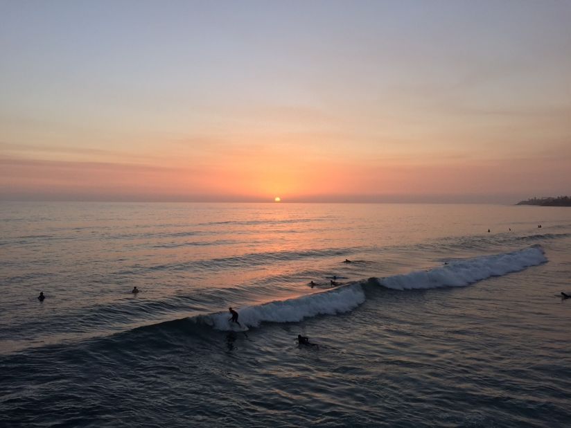 Surfers ride the calm waves in <a href="http://ireport.cnn.com/docs/DOC-1250930">Pacific Beach</a>, a neighborhood that rests between La Jolla and Mission Bay. 