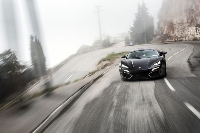 The car boasts diamond-trimmed headlights, gold stitched seats, and a carbon composite body. 