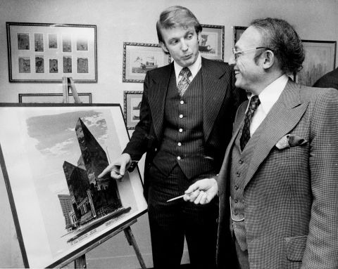 Trump stands with Alfred Eisenpreis, New York's economic development administrator, in 1976 while they look at a sketch of a new 1,400-room renovation project of the Commodore Hotel. After graduating college in 1968, Trump worked with his father on developments in Queens and Brooklyn before purchasing or building multiple properties in New York and Atlantic City, New Jersey. Those properties included Trump Tower in New York and Trump Plaza and multiple casinos in Atlantic City.