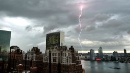 With the United Nations and Tudor City in the foreground, lightning strikes in the sky over the East River  as a major storm approaches New York City July 2, 2014.