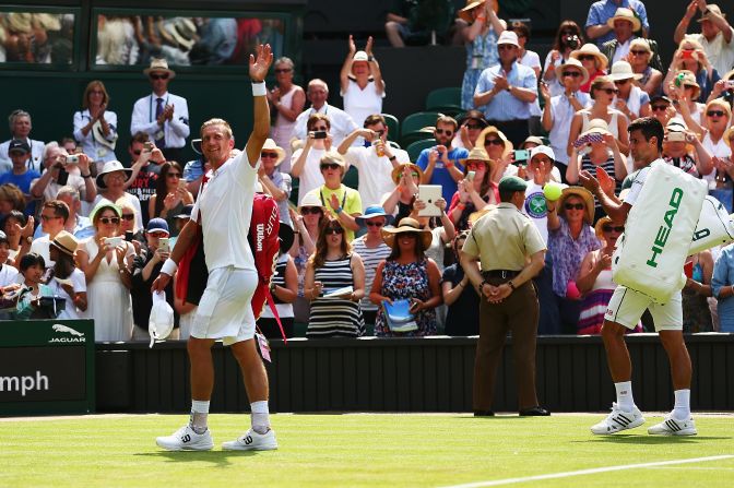 It was Nieminen's final Wimbledon and the ever gracious Djokovic applauded him off tennis' most famous court.
