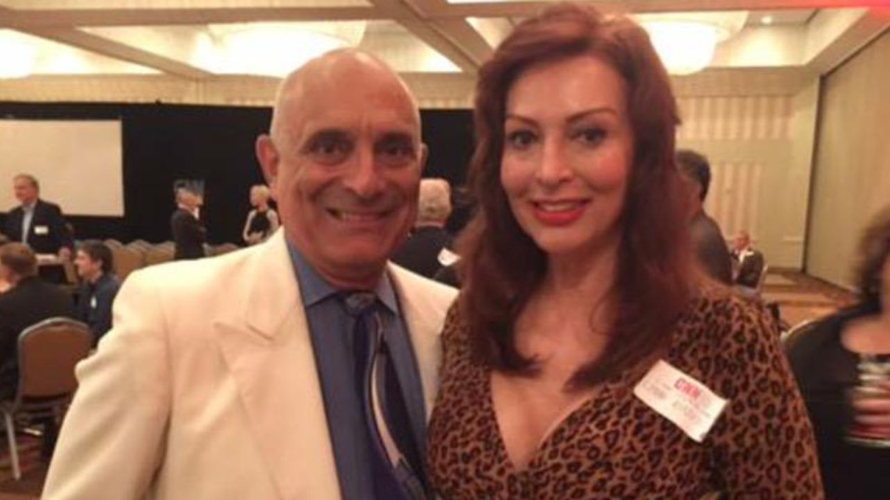 Chuck de Caro and his wife, Lynne Russell, celebrate at a CNN anniversary party in June.