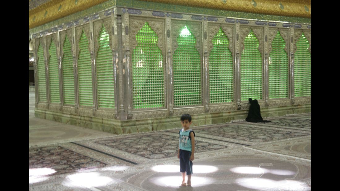 Children play in the shrine while their mothers pray or pay their respects to the late ayatollah.