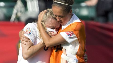 England's Josanne Potter, right, consoles Bassett after the whistle.