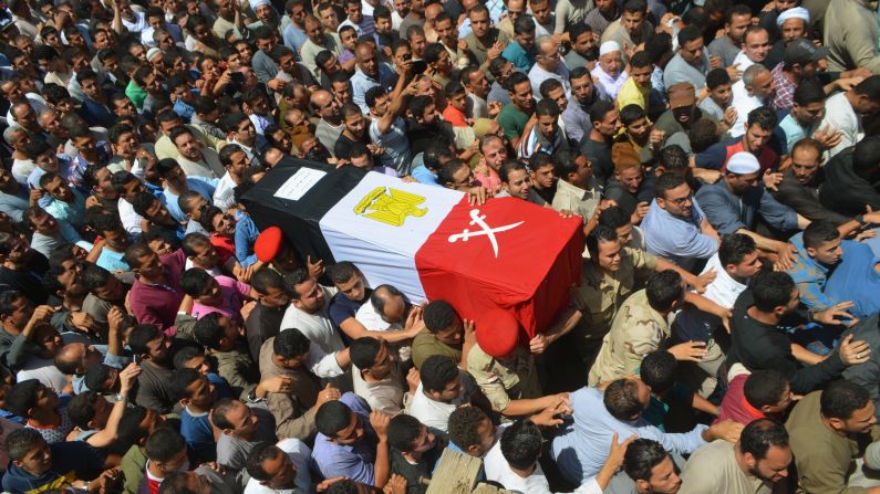 People in Ashmoun, Egypt, carry the coffin for 1st Lt. Mohammed Ashraf, who was killed when the ISIS militant group <a href="index.php?page=&url=http%3A%2F%2Fwww.cnn.com%2F2015%2F07%2F02%2Fworld%2Fisis-egypt-expanding-reach%2Findex.html" target="_blank">attacked Egyptian military checkpoints</a> on Wednesday, July 1. At least 17 soldiers were reportedly killed, and 30 were injured.