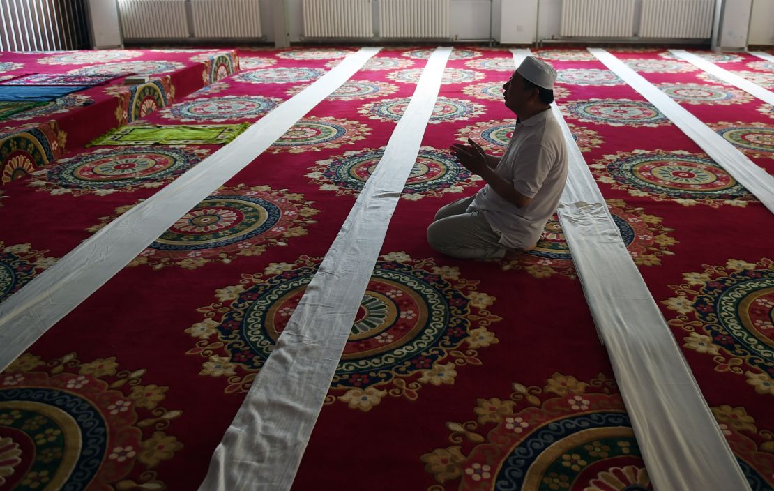 A Chinese Muslim man prays on the first day of Ramadan, the Muslim holy month, at a mosque in Beijing on June 18, 2015.