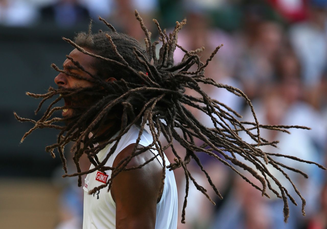 Dustin Brown celebrates after knocking out two-time Wimbledon champion Rafael Nadal in the second round.
